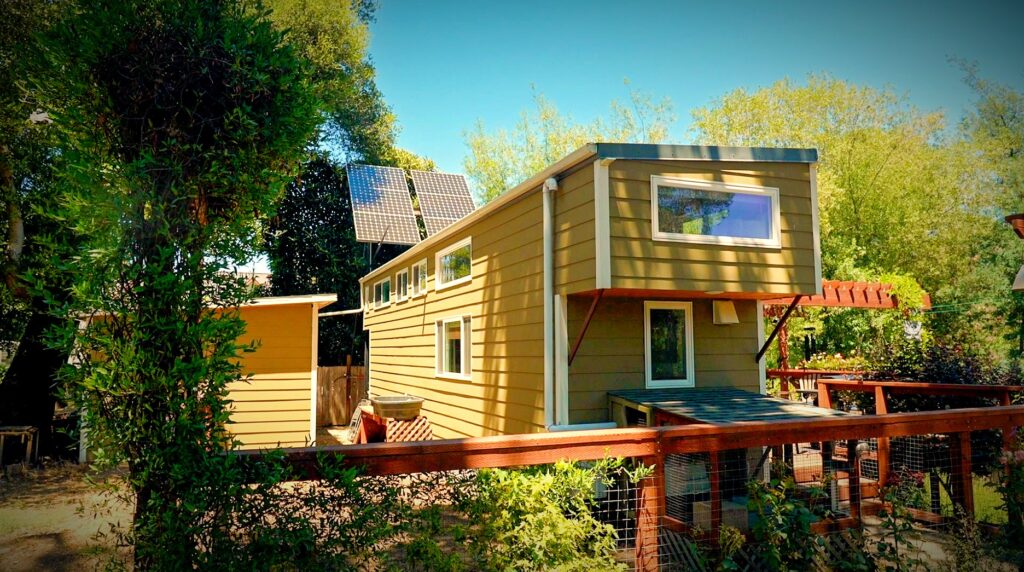 John & Rachel's tiny house solar panel rack is postioned perfectly to maxmize sunlight capture - click to watch the tour!