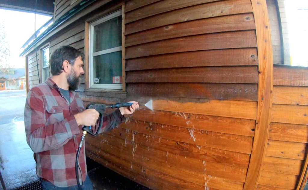 Power washing our cedar siding before resealing done at a car wash on a moving day!