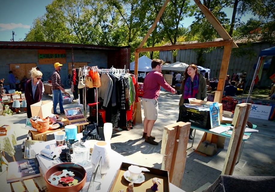 our flea market booth where we sold our downsized belongings to make money for our tiny house build