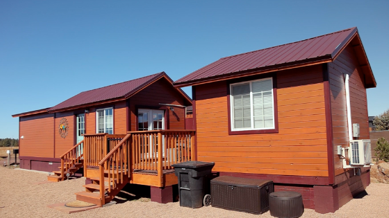 two tiny houses connected by a deck