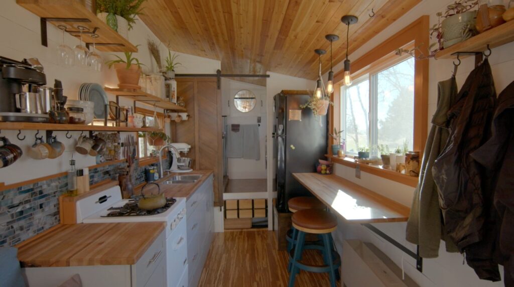 A DIY tiny house chock full of storage - click to watch tour!