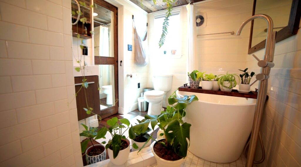 Alex's not-so tiny bathroom in his 10-ft wide tiny house - click to watch tour!